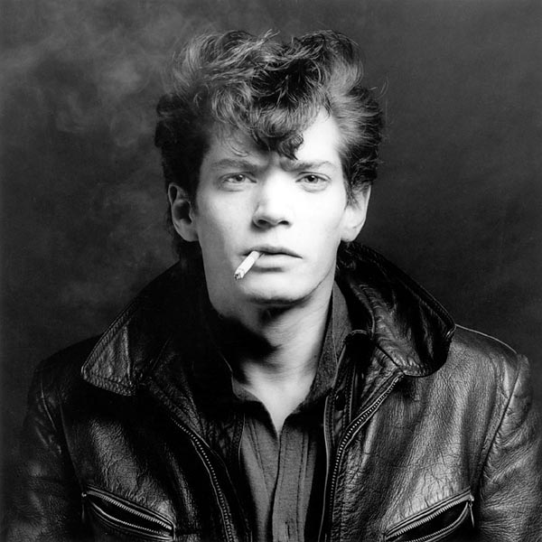 SelfPortrait © Robert Mapplethorpe Foundation. If I violated any rules by using this photo I apologize in advance and will delete all of it when contacted. I do not intend to shock anyone with its content; it's merely used to support my piece. Self Portrait of Robert Mapplethorpe.